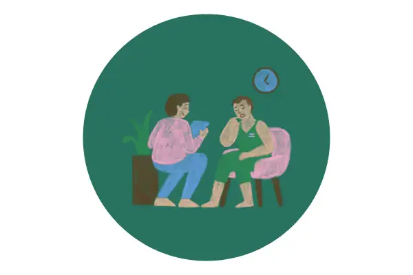 Terapia. Pacjent opowiada o swoich problemach, a terapeuta notuje w dzienniku uczuć.